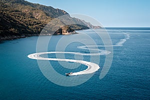 Pleasure boat snakes towards Porto in Corsica