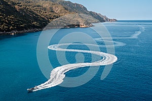 Pleasure boat snakes towards Porto in Corsica