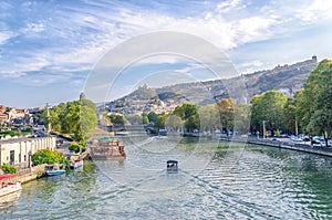 Pleasure boat on the waves of the Kura River in Tbilisi Georgia