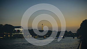 Pleasure boats cruising on the Seine in the evening in Paris, Eiffel Tower view