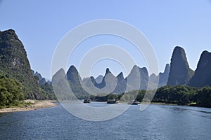 Pleasure Boats on The Li River in The Karst Mountains. Guilin, Guangxi, China. October 30, 2018.