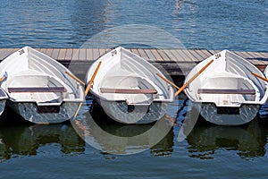 Pleasure boats at the pier on the lake.