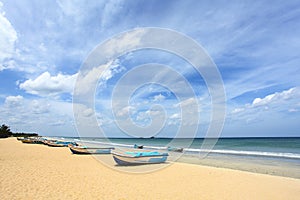 Pleasure boats in sunny beach, Trinkomalee, Sri Lanka.