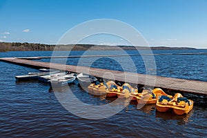 Pleasure boats and water catamarans on lake Krasnogvardeyskoye near Zelenogorsk.