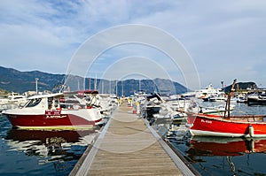 Pleasure boats and yachts at pier on waterfront, Budva, Monteneg