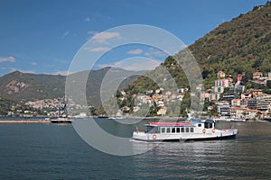 Pleasure craft on lake in mountains. Como, Italy