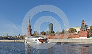 Pleasure motor ship on the Moskva River near the walls of the Kremlin embankment in Moscow