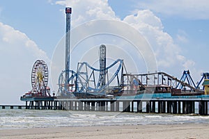 Pleasure Pier on Galveston Island, Texas extends out into the Gulf of Mexico photo