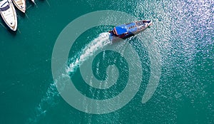 Pleasure white yacht coral reef in blue transparent turquoise water sea. Aerial top view