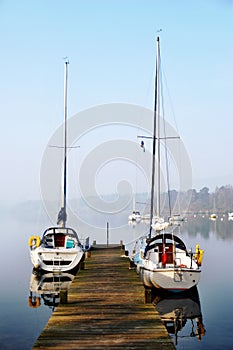 Pleasure yachts moored on rustic jetty