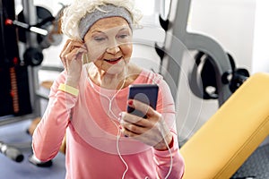 Pleasured beneficiary listening music in gym