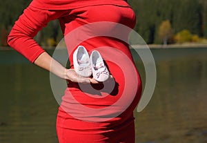 Pleasured pregnant young woman