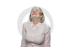 Pleasured and relaxed mature woman with her eyes closed.