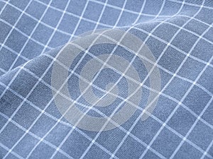 Pleated checkered blue fabric