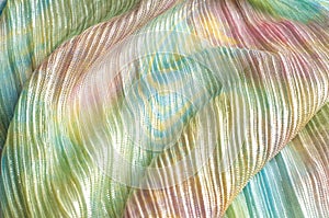 Pleated fabric with colorful abstract drawings