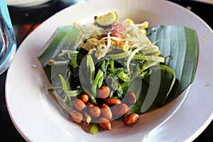 Plecing kangkung, a traditional salad dish from Lombok or Bali, photo