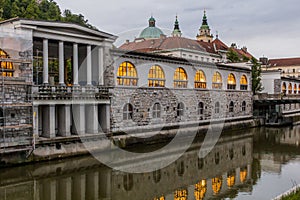 Plecnik arcade market building and Ljubljanica river in Ljubljana, Sloven