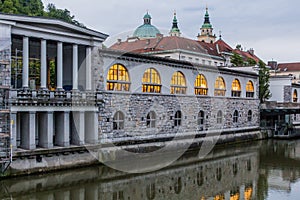 Plecnik arcade market building and Ljubljanica river in Ljubljana, Sloven