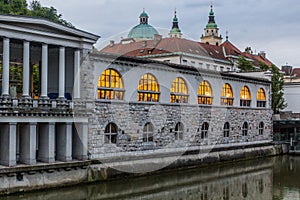 Plecnik arcade market building and Ljubljanica river in Ljubljana, Sloven