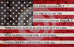 The pledge of allegiance on weathered flag