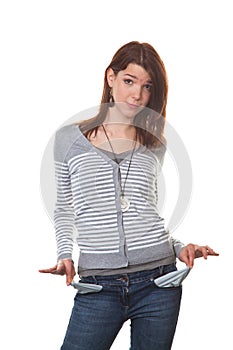 Pleite young woman showing her empty pockets