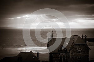 Pleneuf Val Andre city and beach view at sunset, Brittany, France. Black and white