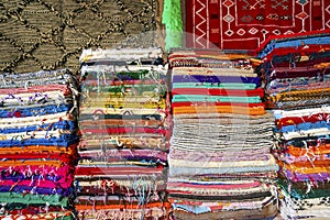 Plenty of famous traditional Berber carpets on sale, in Morocco