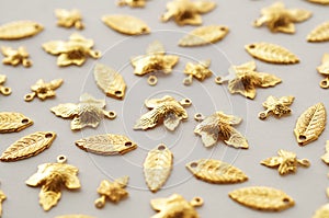 Plenty of gold shining metal leaves. Jewelry findings