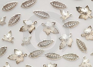 Plenty of silver shining metal leaves. Jewelry findings