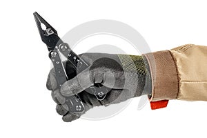 Pliers of black multipurpose knife in worker hand in black protective glove and brown uniform isolated on white background