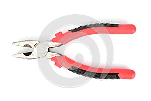 Pliers with black and red handles isolated on white background