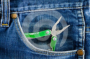 Pliers in blue jeans pocket