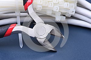 Pliers with cables and bunch of cable ties