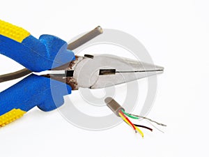 Pliers cutting a cable