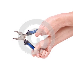 Pliers in the hand of a girl. Symbol of hard work, feminism and labor day. Isolate on white background