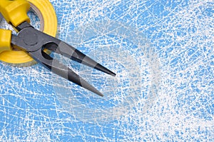 Pliers hand tool on blue