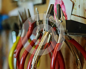 pliers and hand tools in jewellers workshop