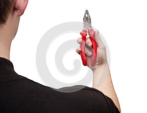 Pliers in his hand