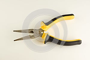 Pliers with a long working part and dielectric handles