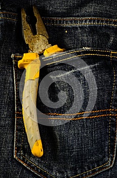 Pliers in a pocket of the jeans