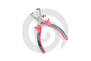 Pliers for removing isolation from electrical cables with red handles isolated on a white background. Electrician tool