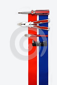 Pliers screwdriver metal pliers screwdriver cutter flag red blue white ribbon bow postcard background labor Dutch