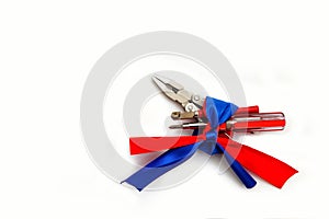 Pliers screwdriver metal pliers screwdriver cutter flag red blue white ribbon bow postcard background labor Dutch