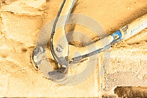 Pliers tool for carpenter on sawdust table background.Equipment for crafts