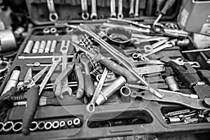 Pliers and wrenches on the table in the garage.