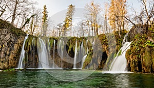 Plitvice Lakes National Park during colorful autumn, Croatia, Europe. Fall colors leafs on trees. Waterfalls and water in sunny