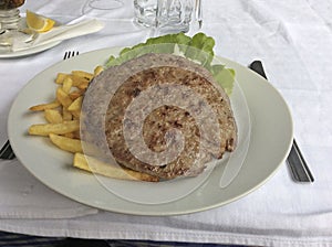 Pljeskavica pljeskavitsa Balkan meat burger in cafe photo