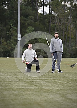 PLL, professional lacrosse players, Matt Rambo and Austin Pifani at a youth lacrosse clinic.