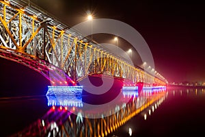 Plock, Poland - Road-railway bridge over the Vistula Wisla river in illuminated at night