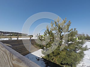 Plot of land in winter. Construction of a private house. Fence on the land in winter